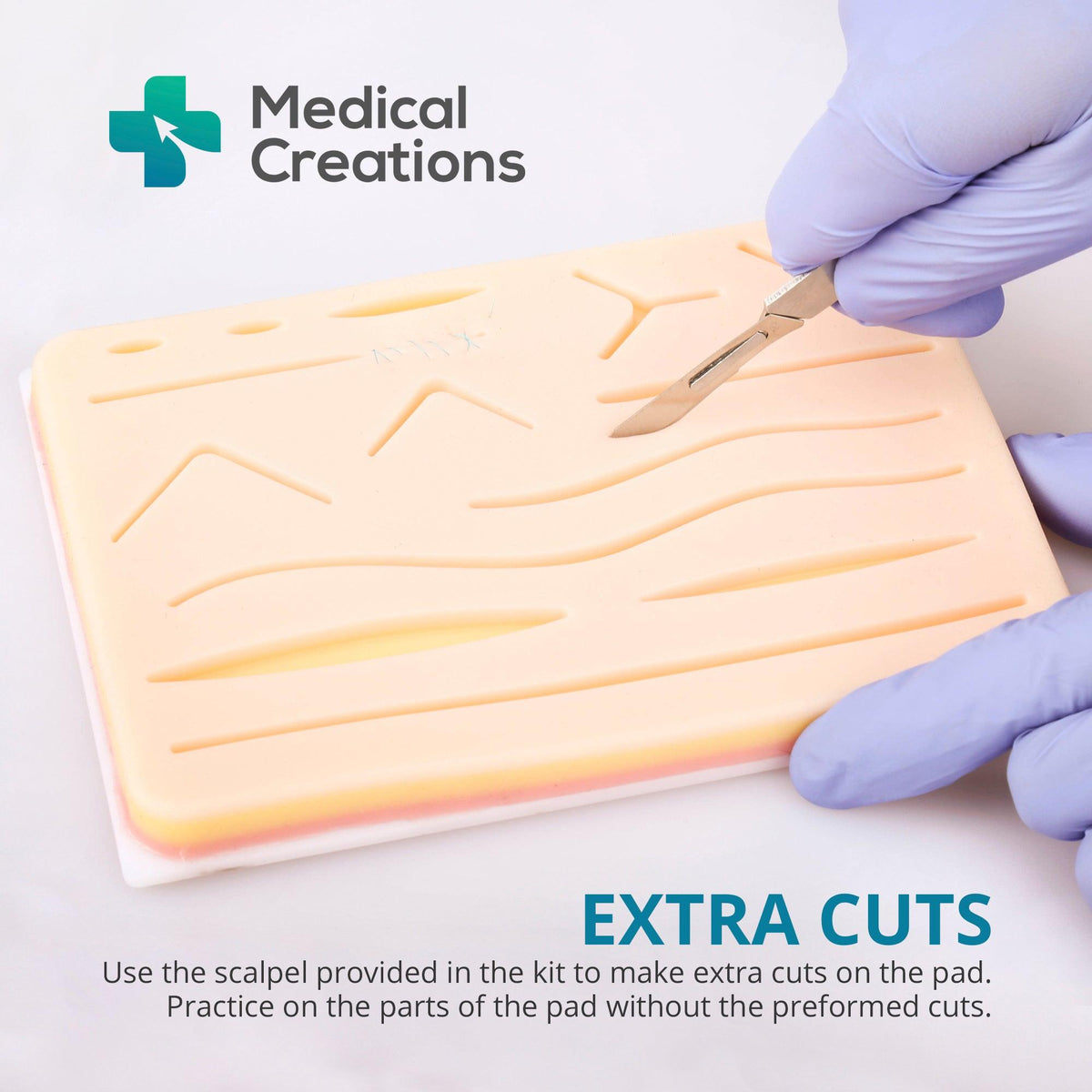 Making an extra cut on the suture practice pad with the kit's scalpel
